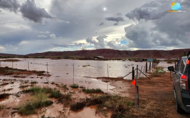 An automobile halts near rising floodwaters close to Chinle, Arizona on Tuesday, Sept 15, 2026 