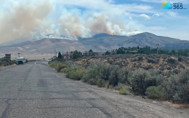 Smoke and flames rise from the Hawk Fire near Reno, Nevada, on Aug. 22, 2026